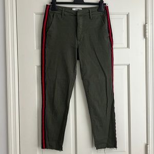 Pistola army green pants with red stripe lining on the sides.